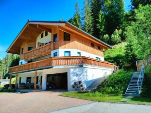 a house with a balcony on top of it at Haus Jakob in Filzmoos