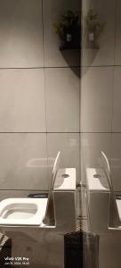 a bathroom with two sinks and a mirror at Saanvi Farmhouse in Hampi