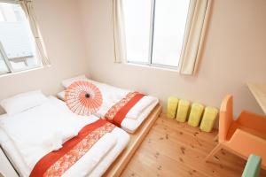 Postel nebo postele na pokoji v ubytování OHAYO Hotel 大森西