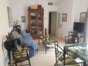 a living room with a couch and a table at Bogavante Costa Ballena in Rota