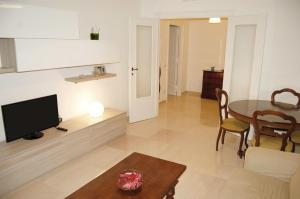 A television and/or entertainment centre at Vatican In The Moonlight Apartment
