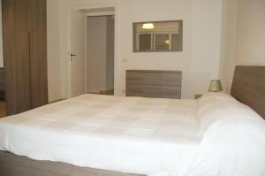 A bed or beds in a room at Vatican In The Moonlight Apartment