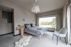 Postel nebo postele na pokoji v ubytování Ilmaveere Butiikhotell ja Restoran