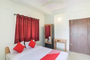 Katil atau katil-katil dalam bilik di Oxy Hotel Prashant
