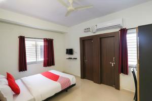 Katil atau katil-katil dalam bilik di Oxy Hotel Prashant