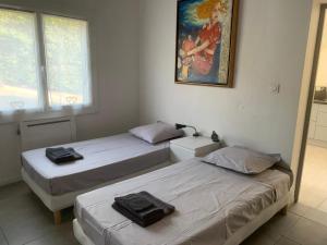 Postel nebo postele na pokoji v ubytování Corsicadream Arone superbe appartement dans villa, vue panoramique mer, piscine, proche Porticcio