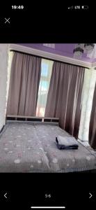 Ένα ή περισσότερα κρεβάτια σε δωμάτιο στο Paris