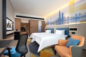 TV a/nebo společenská místnost v ubytování Hampton by Hilton Shenzhen Longgang Yonghu