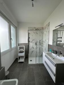 a bathroom with a shower and a sink at FiorIris del lago in Stresa