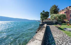 a walkway next to a body of water at Villa Sista in Roina