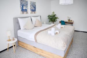 a bedroom with two beds with white pillows at Penthouse Apartment mit Dachterrasse, Top Lage in Weinheim