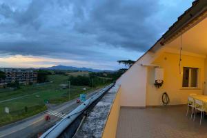 a balcony of a building with a view of a road at Sibilla Tiburtina House Attico Roma con parcheggio in Rome