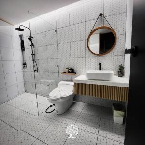 a bathroom with a shower and a toilet and a sink at Tree Space Living in Ban Don Ta Koet +38 photos