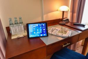 TV a/nebo společenská místnost v ubytování Atrium Hotel Amadeus