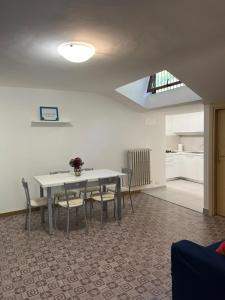 a dining room with a table and chairs at Amoroso's house, affittacamere in Caramanico Terme +32 photos