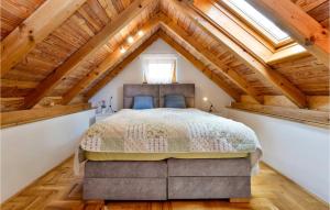 a bedroom with a bed in a attic at 3 Bedroom Beautiful Home In Piscanovec in Tuhovec