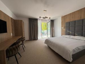 Posteľ alebo postele v izbe v ubytovaní Resort EDEN domki, apartamenty i pokoje
