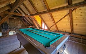 a pool table in the middle of a room at Awesome Home In Prodin Dol in Ivančići