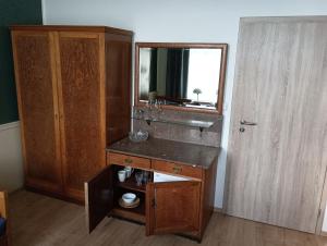 a bathroom with a sink and a mirror at Apartments Bouquet in Prague +27 photos