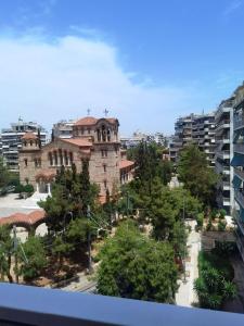 an old building in the middle of a city at 110 Sqm 2BR Edem beach luxury apartment in Athens
