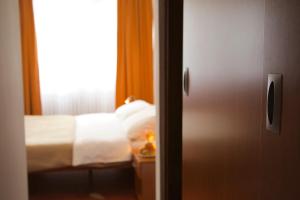 Postel nebo postele na pokoji v ubytování Hotel Srbija-FREE PARKING