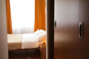 Voodi või voodid majutusasutuse Hotel Srbija toas