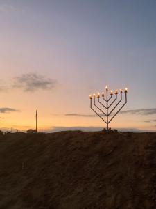 an object with lights on top of a hill at avraham B''H in Nevatim