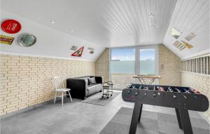a room with a pool table and a couch at Holiday Home Kræ Degns Vej Ringkøbing Iii in Klegod +32 photos