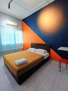 Postel nebo postele na pokoji v ubytování My Segamat Homestay