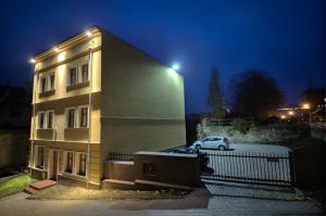 a building with a car parked in front of it at Na Górnej in Jelenia Góra