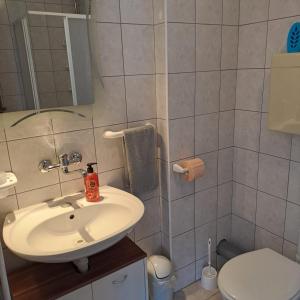 Koupelna v ubytování Apartments Cecilija