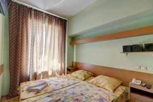Кровать или кровати в номере Апарт- отель Невский 78 