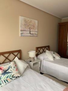 Ένα ή περισσότερα κρεβάτια σε δωμάτιο στο Piso Ortigueira Centro