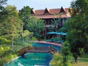 a resort with a bridge over a pool at Angkor Village Resort & Spa in Siem Reap
