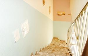 a staircase in a house with rocks on the wall at Pet Friendly Home In Oberaula-Hausen in Hausen +11 photos