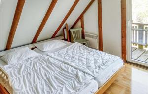 a white bed in a room with a window at Ferienhaus 30 In Frankenau in Frankenau