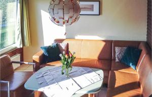 a living room with a couch and a table at Ferienhaus 30 In Frankenau in Frankenau