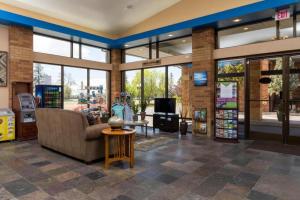 a store lobby with a couch and a tv at Cerulean Hotel, a Running Y Property in Klamath Falls