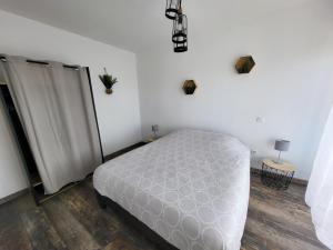 Ένα ή περισσότερα κρεβάτια σε δωμάτιο στο Aparthotel Des 2 Caps