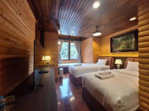 Katil atau katil-katil dalam bilik di บ้านคุณอัง Baan Khun Ang