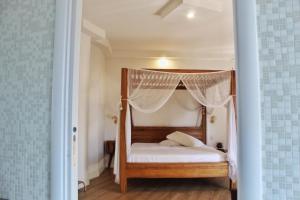 Postel nebo postele na pokoji v ubytování Domino Hotel