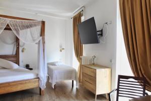 Postel nebo postele na pokoji v ubytování Domino Hotel