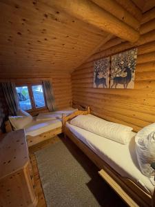Postel nebo postele na pokoji v ubytování Tiroler Blockhaus + 25 fotografií