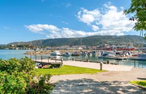 a marina with boats docked in a harbor at Cozy nest- walking distance to city center in Bergen