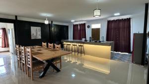 a dining room with a table and a bar at La Finca - Santa Cruz - Chile in Santa Cruz