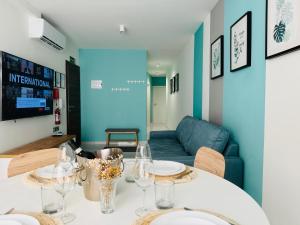 a dining room with a table with wine glasses on it at SeeYou in St. Paul's Bay