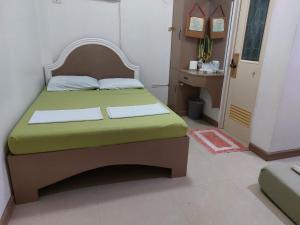 Postel nebo postele na pokoji v ubytování Yuken Mari Beach Resort Panglao