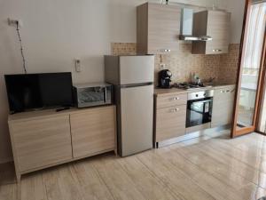 Kuchyň nebo kuchyňský kout v ubytování Relax Rosolina Mare