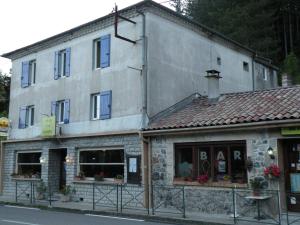 a building on the side of a street at Retour Aux Sources in Meyras