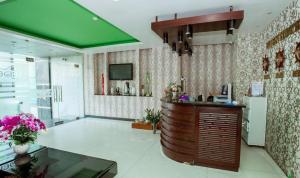 a kitchen with a counter and a green ceiling at Eden Hotel Sai Gon in Ho Chi Minh City